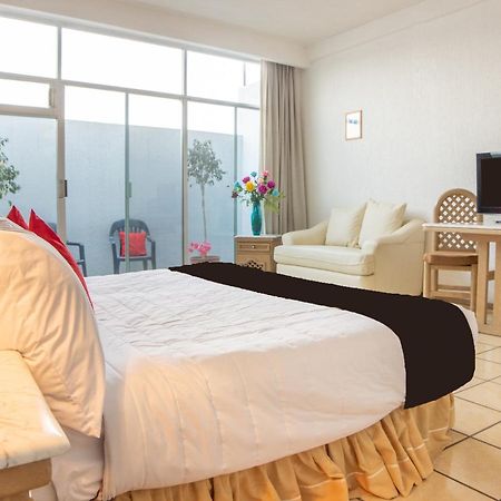 Capital O Hotel Villa Monini 푸에블라 외부 사진
